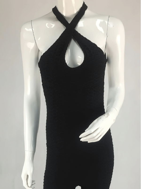 Women's textured open-back yoga jumpsuit, showcasing lightweight, breathable, anti-pilling fabric in stylish black.